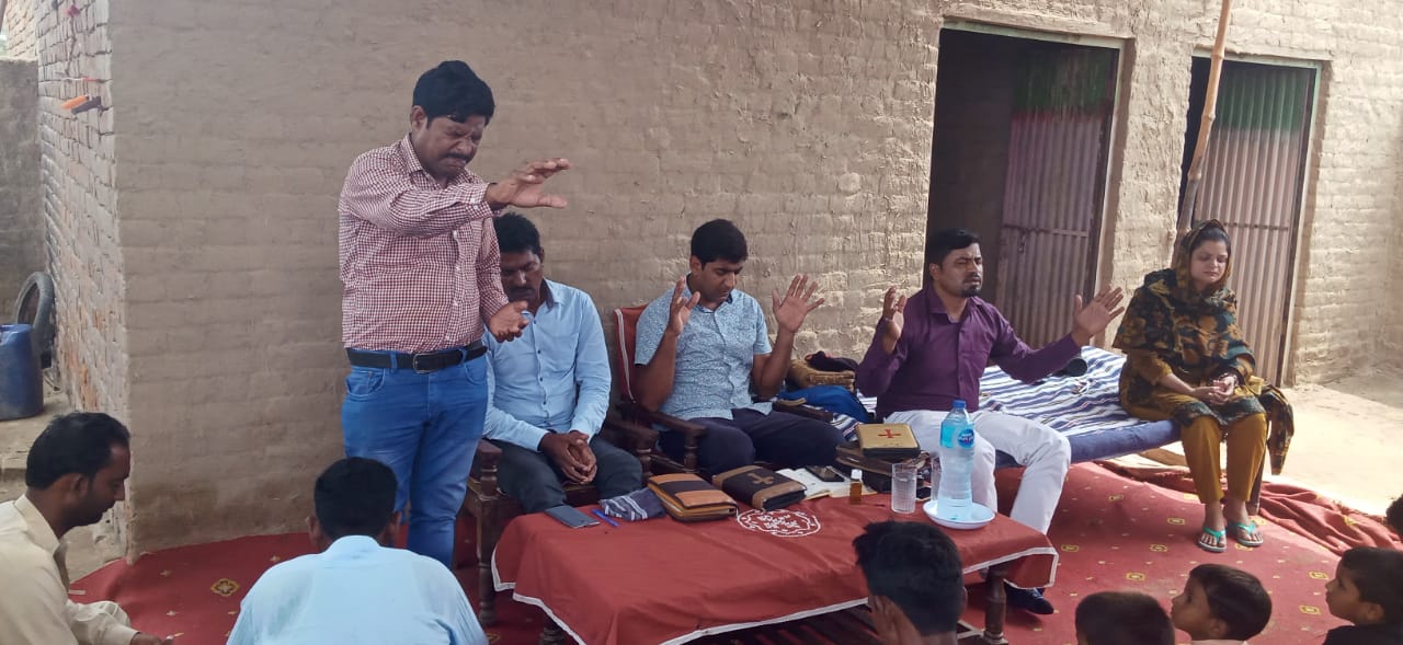 A group of people sitting at a table

Description automatically generated