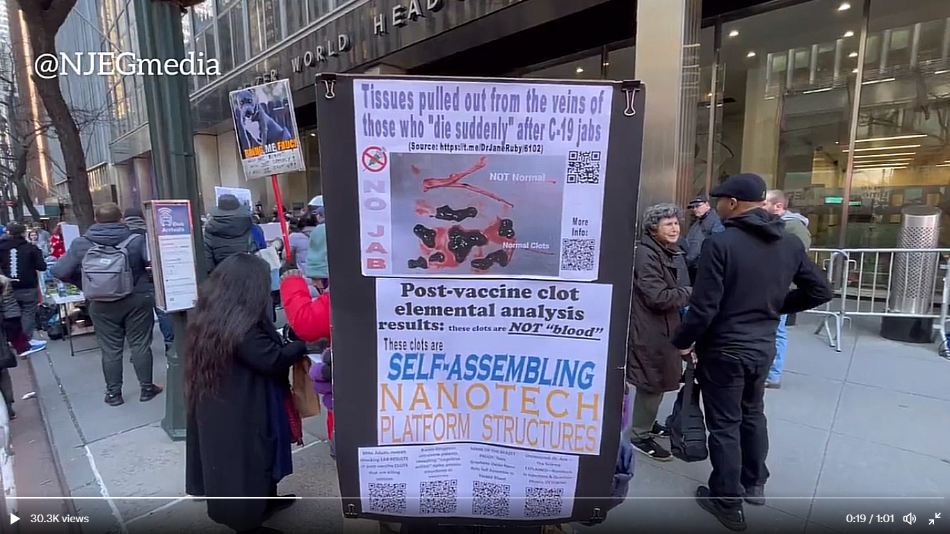 A group of people standing next to a sign

Description automatically generated with low confidence