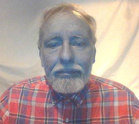 A person with a beard and mustache
AI-generated content may be incorrect.