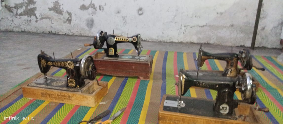 A picture containing appliance, sewing machine, indoor, colorful

Description automatically generated